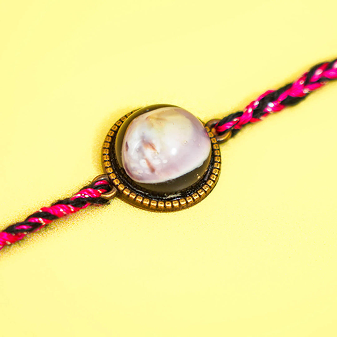 Bio Resin Brown Shell Rakhi Green - Close-up of sixth shell centerpiece