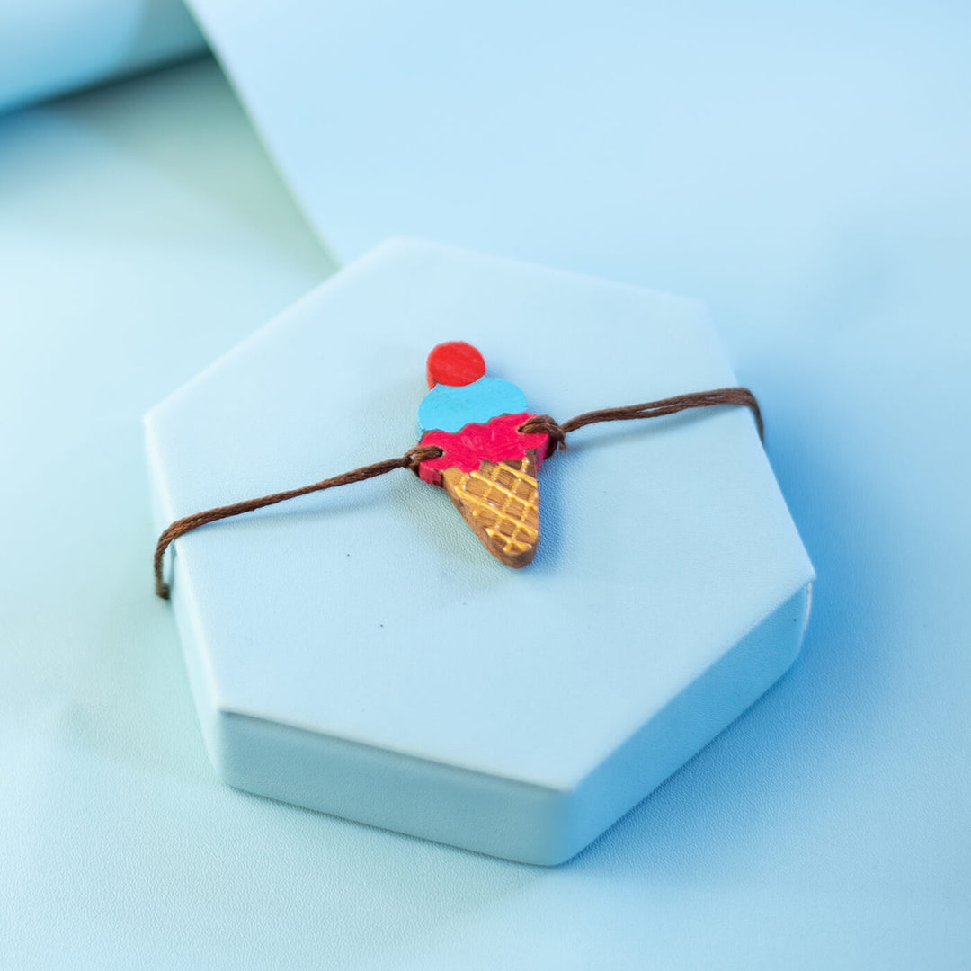 Handpainted Wooden Rakhi Silly Face - Ice Cream Charm Front