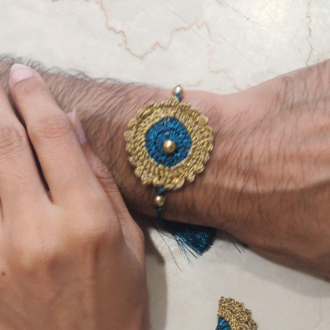 Peacock Blue Gold Bhaiya Bhabhi Lumba Rakhi Set - Worn on Wrist Close-up