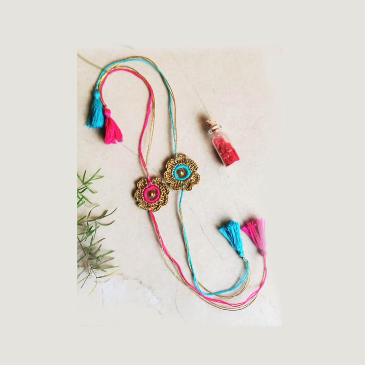 Turquoise Pink Gold Sequin Zari Rakhi Set - Laid Out Flat Display