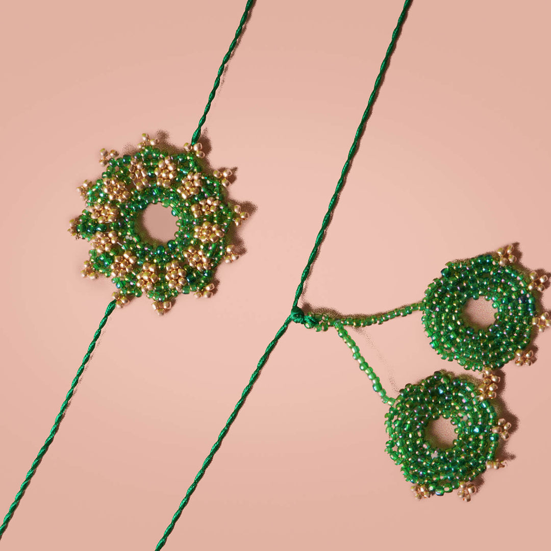 Handcrafted Bhaiya Bhabhi Round Rakhi Set Green - Close-up of beaded threads (13)