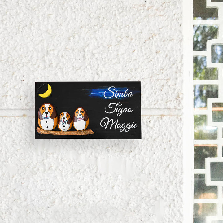 3 Dogs Pebble Art Name Plate - Mounted on Wall with Window Nearby