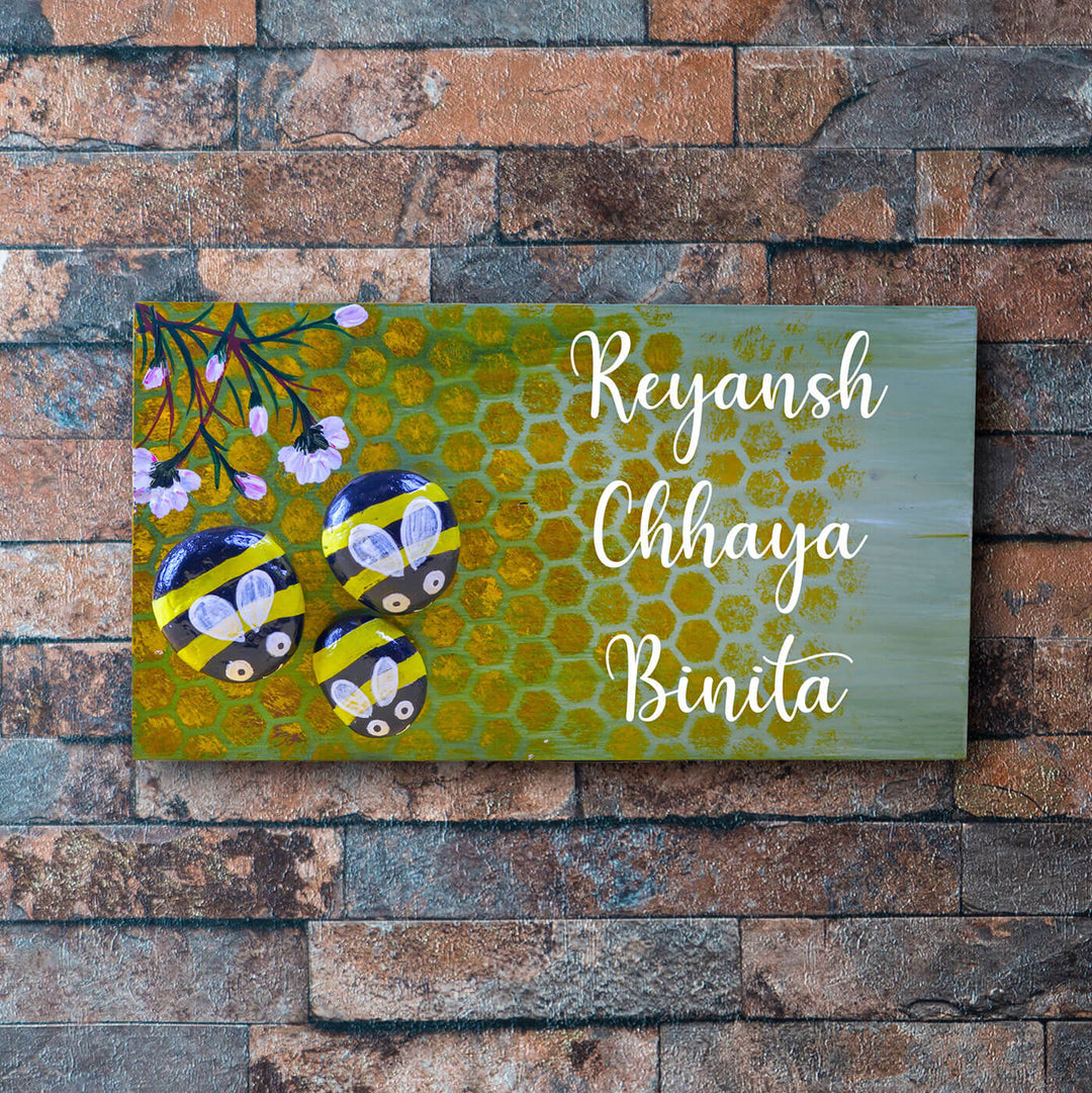 Hand Painted Pebble Name Plate Honey Bees - Mounted on Brick Wall Front View