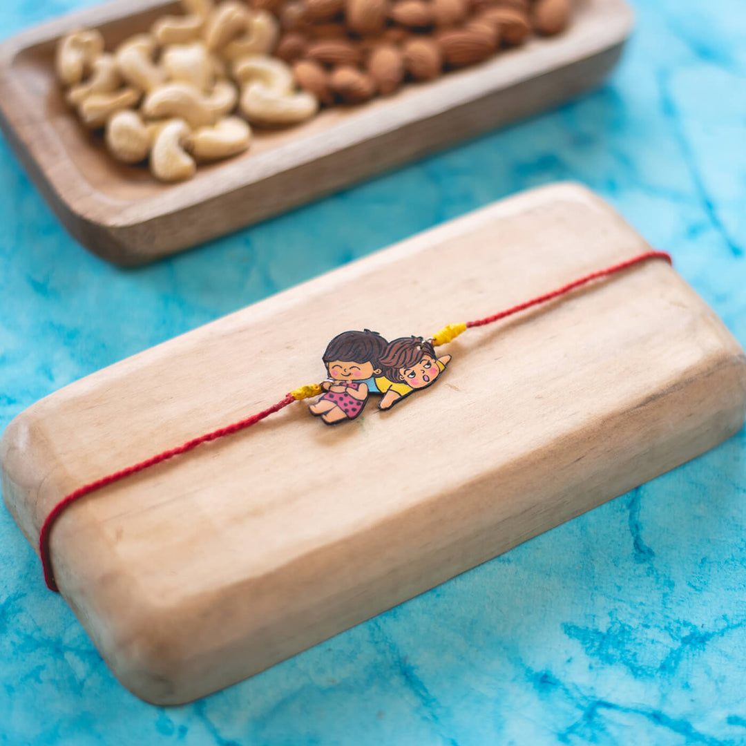 Sibling Illustration Rakhi Type 2 - Rakhi on wooden block background