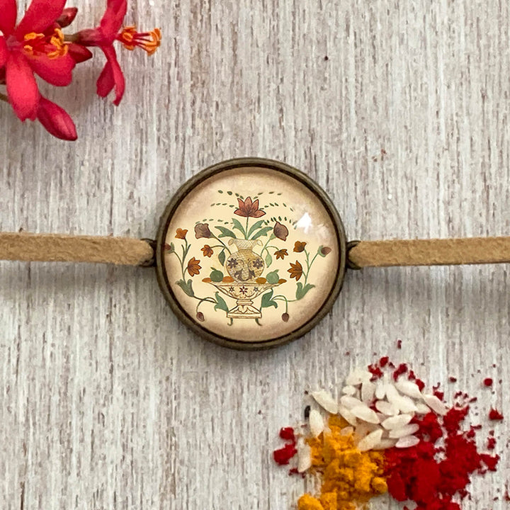 Gond Rooster Handcrafted Folkart Rakhi - Close-up Front View with Red Flower Motif