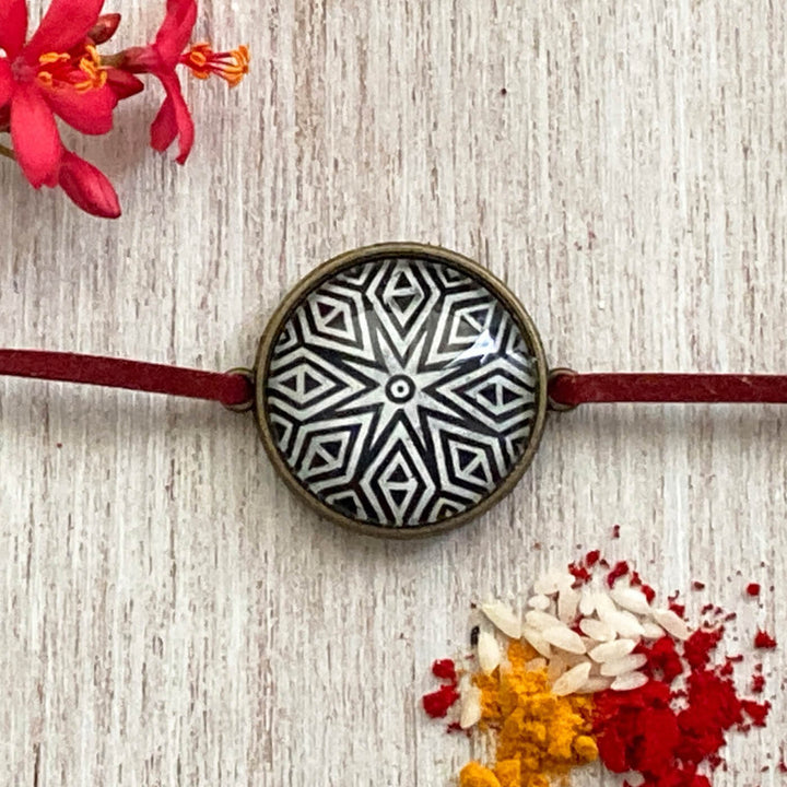 Lord Ganesha Kalighat Pat Folkart Rakhi - Close-up Front View Geometric Design
