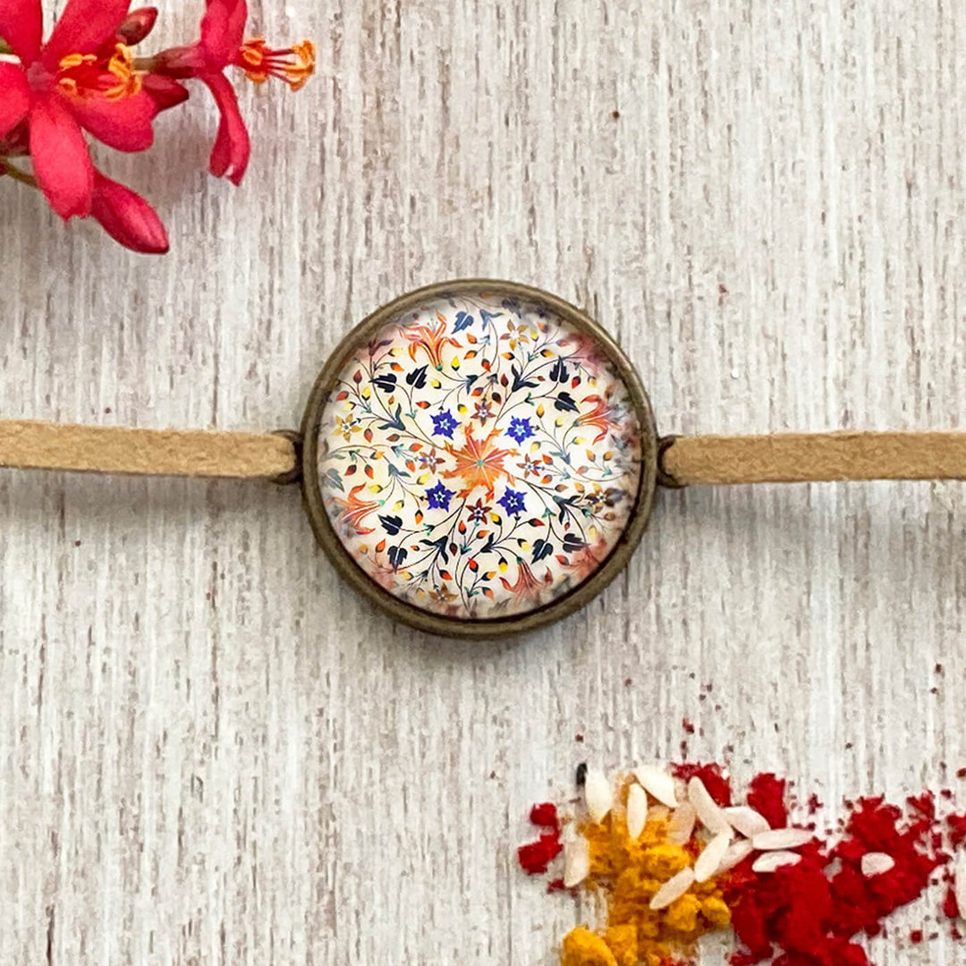 Lord Ganesha Kalighat Pat Folkart Rakhi - Close-up Front View Floral Pattern
