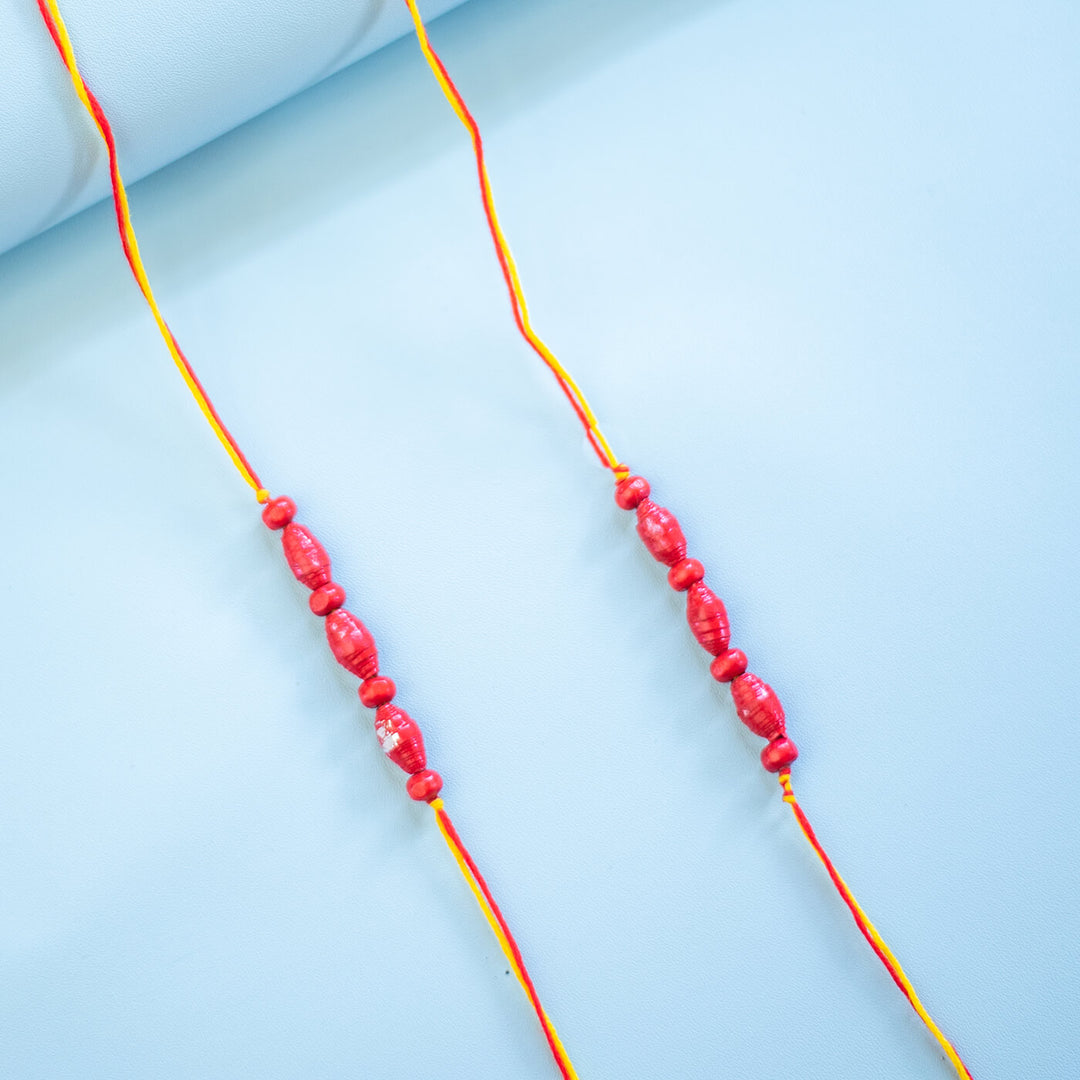 Paper Woven Beaded Rakhi Set With Roli Chawal 1 - Close-up of Pair of Bracelets