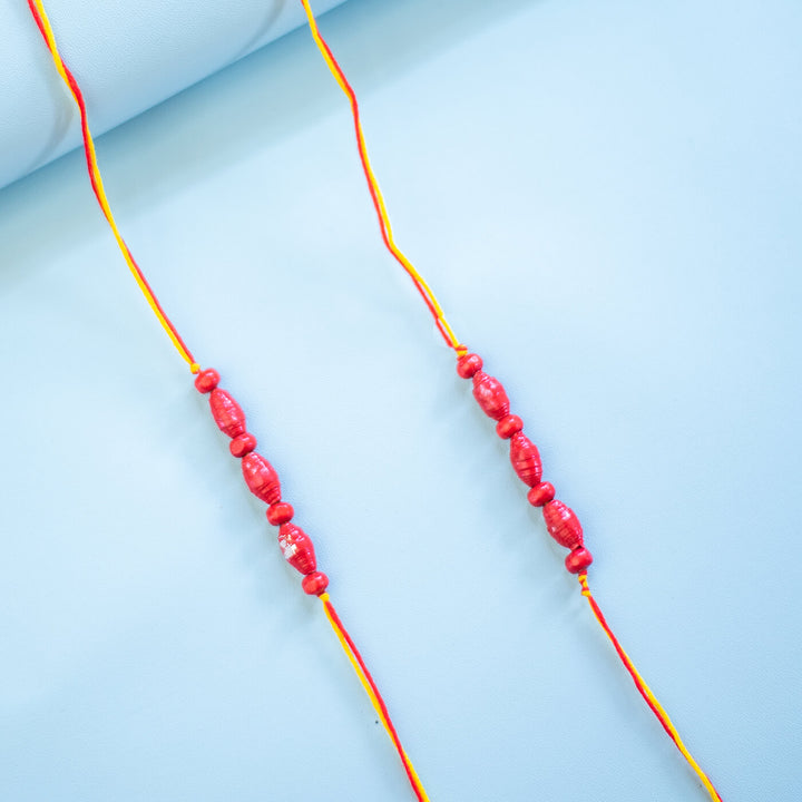 Paper Woven Beaded Rakhi Set With Roli Chawal 1 - Close-up of Pair of Bracelets