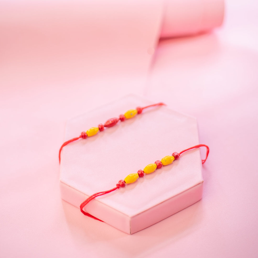 Paper Woven Beaded Rakhi Set With Roli Chawal 1 - Bracelets on Gift Box Display