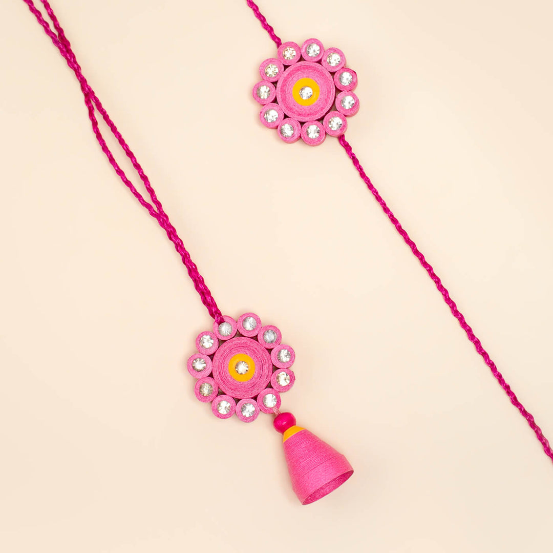 Paper Mache Rakhi Bhaiyya Bhabhi Set Pink - Close-up of Rakhi threads