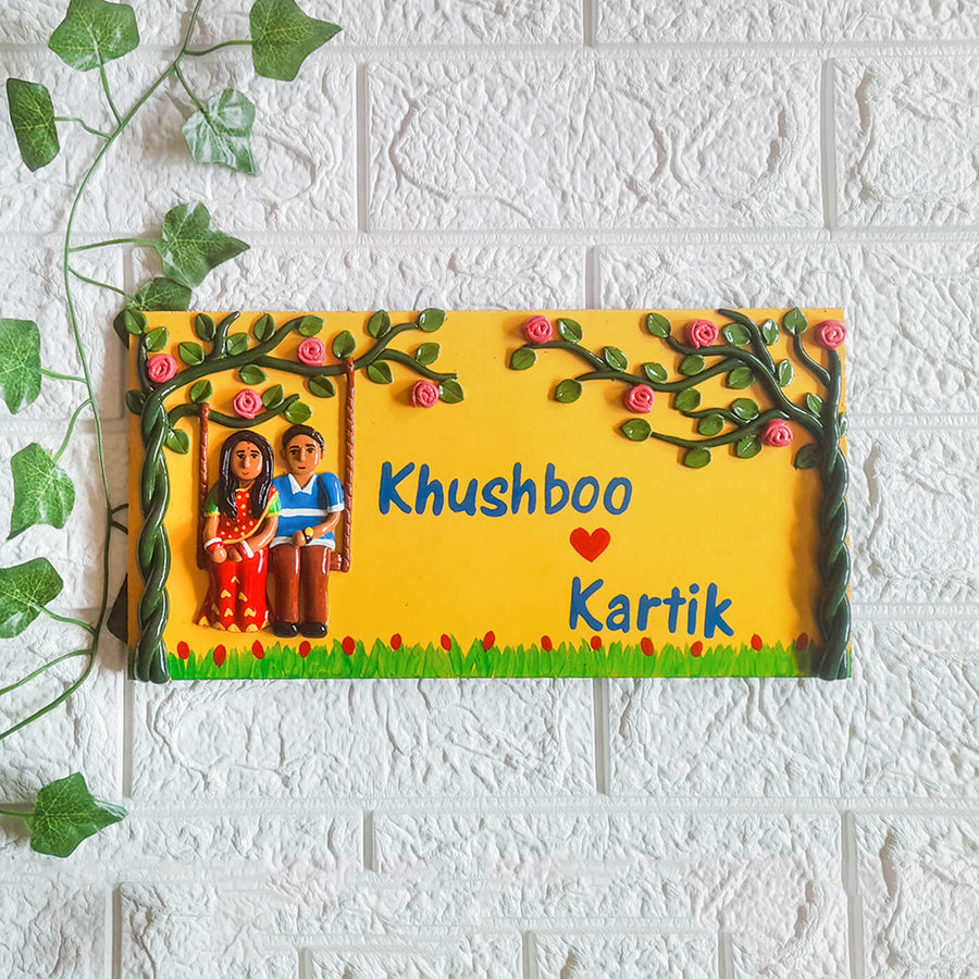 Handmade Couple Name Plate With Personalised Clay Figures - Front View Mounted on Wall