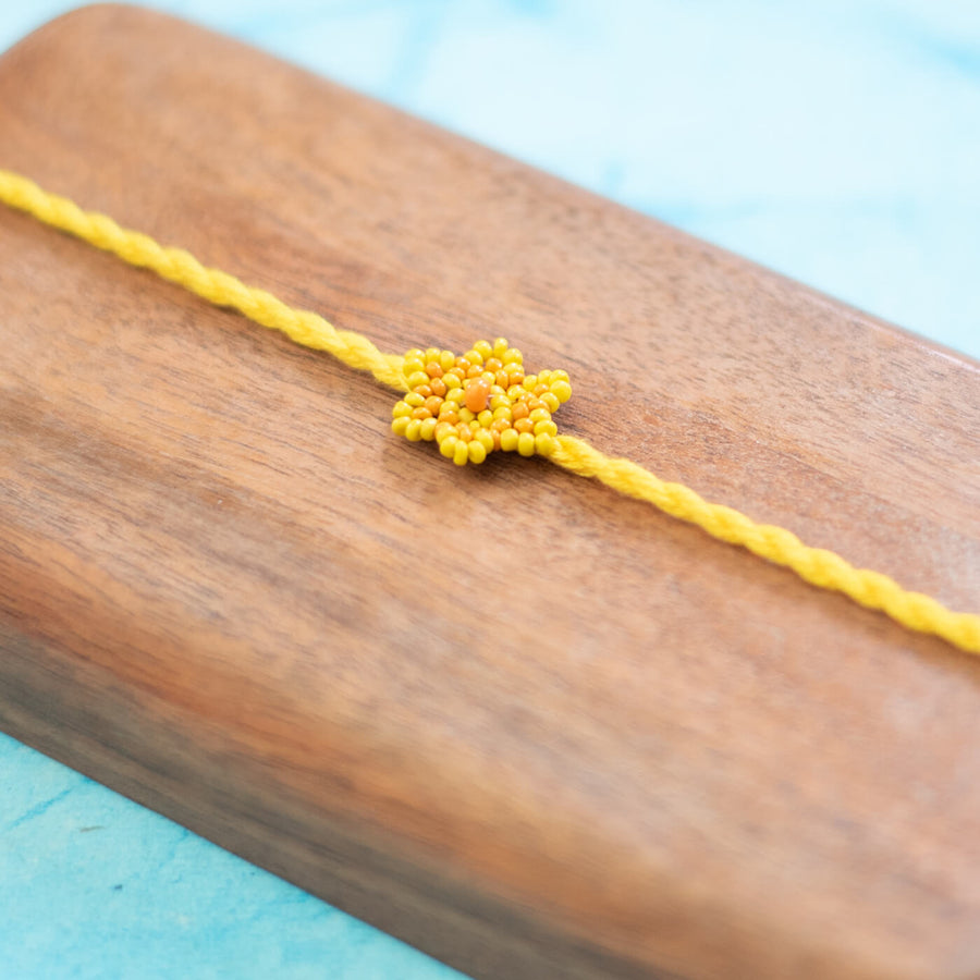 Sitara Collection Glass Beeds Rakhi Yellow - Close-up of beadwork detail
