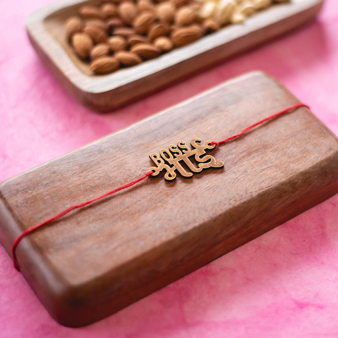 Boss Bhai Mdf Rakhi - Bracelet displayed on wooden board