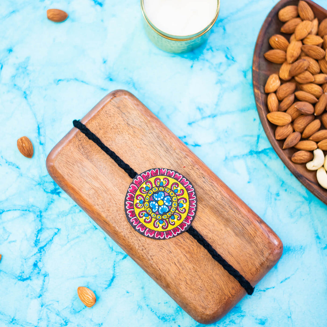 Hand Painted Seed Rakhi Black - Styled with Nuts and Milk