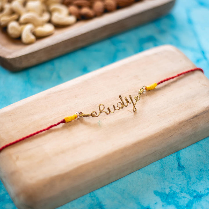 Personalized Rakhi English - Styled Close-up on Wooden Surface