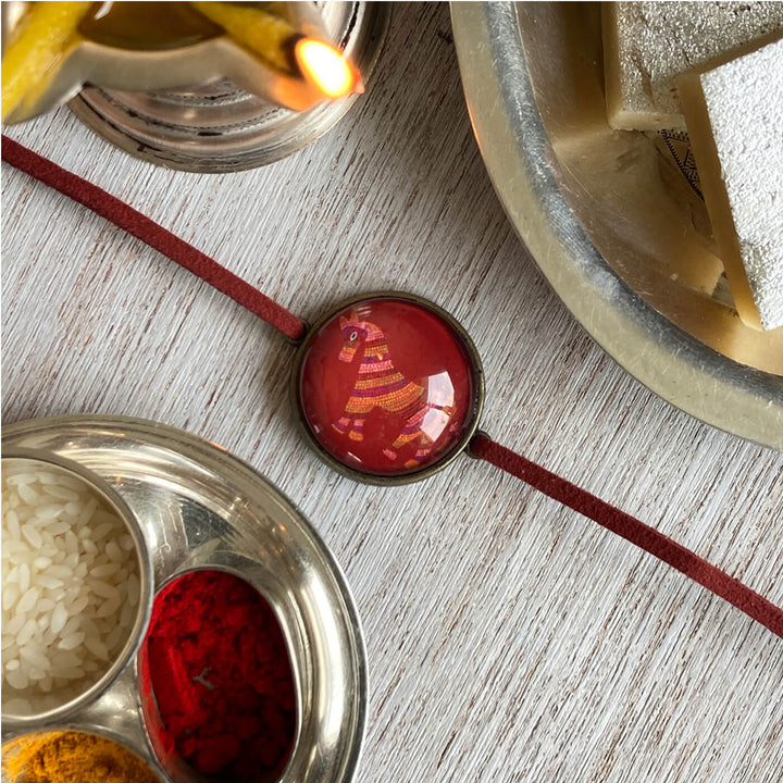 Bhil Horse Handcrafted Folkart Rakhi - Rakhi with Sweets and Powders