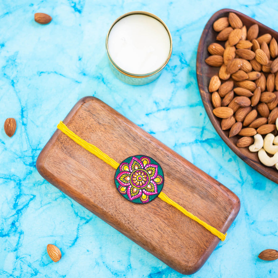 Hand Painted Seed Rakhi Yellow Unbraided - On Wooden Tray Display
