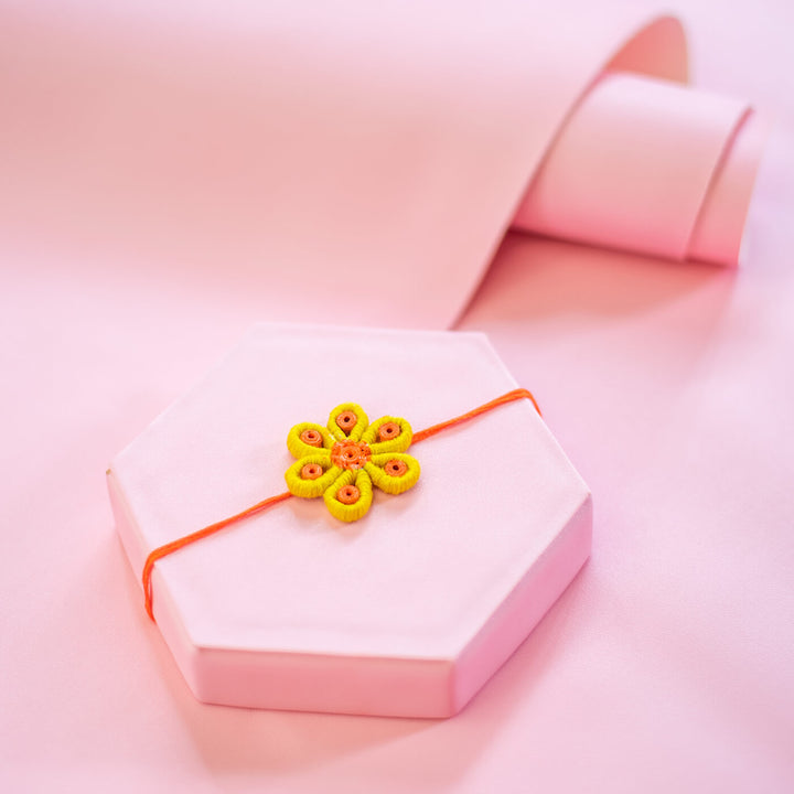 Paper Mache Rakhi Yellow Blossom - Styled on Decorative Hexagon Box