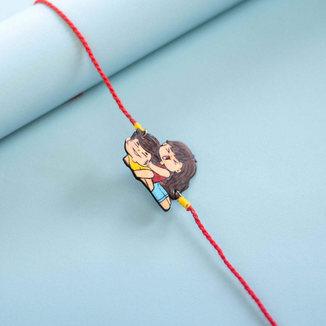 Sibling Illustration Rakhi Type 2 - Close-up of sister hugging charm