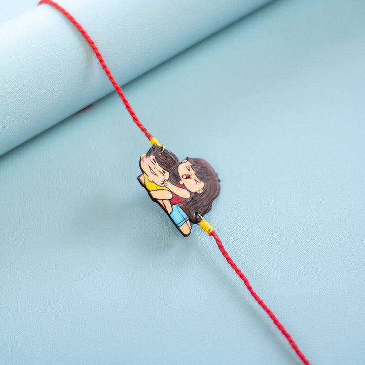 Sibling Illustration Rakhi Type 2 - Close-up of sister hugging charm