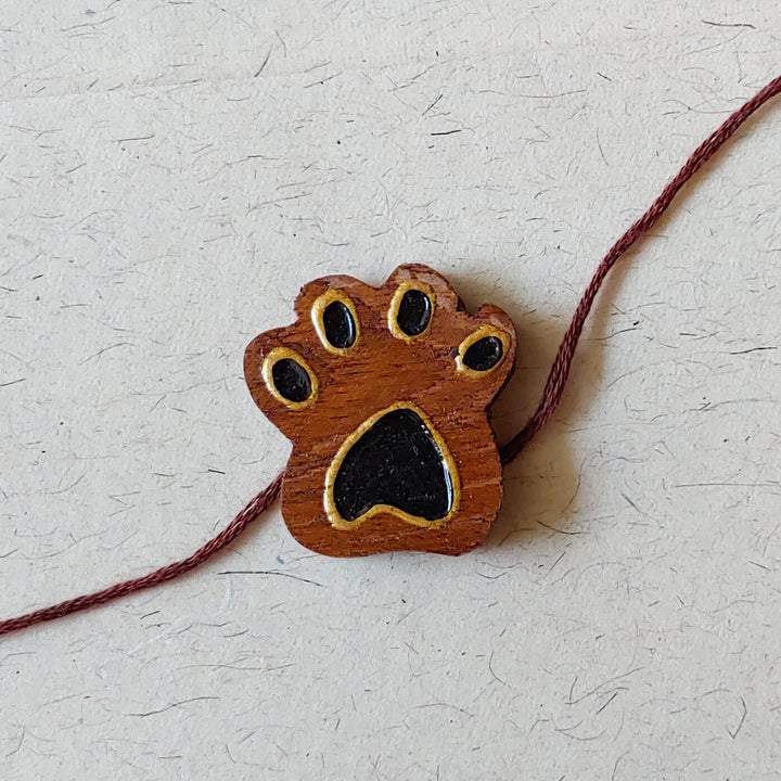 Handpainted Wooden Rakhi Mini Bird 1 - Paw print charm on bracelet string