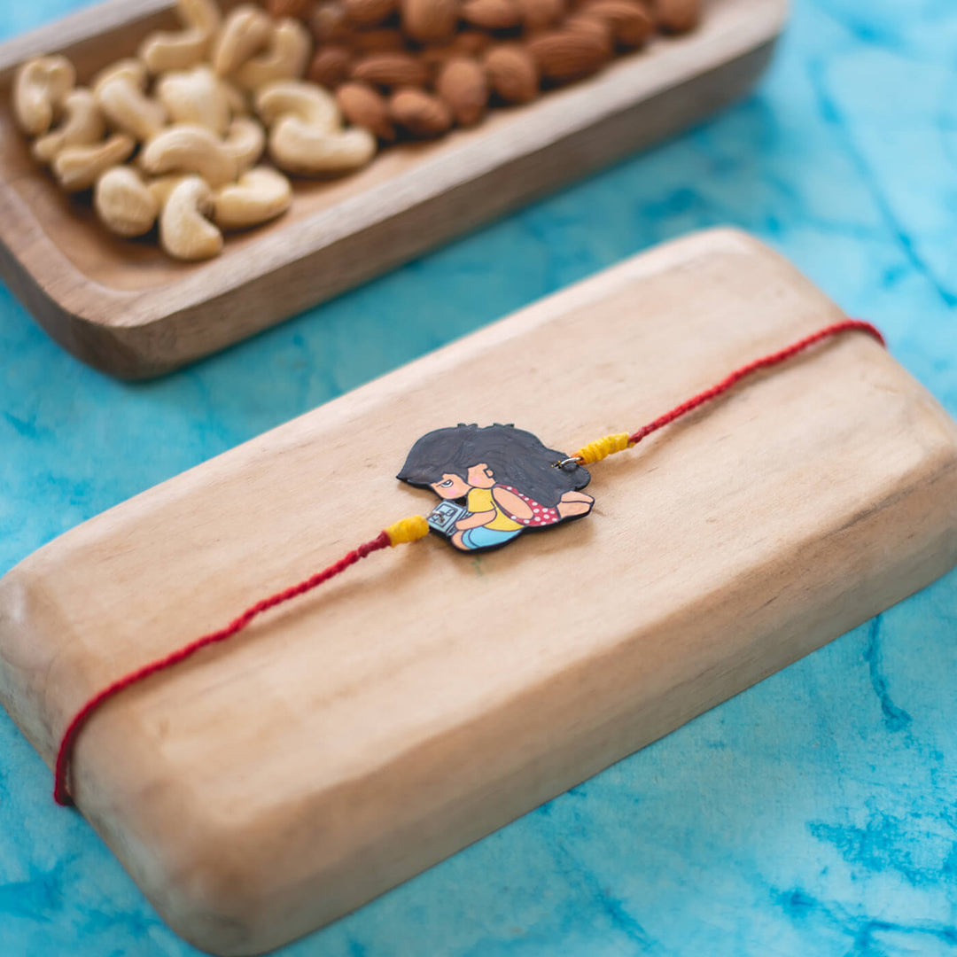 Sibling Illustration Rakhi Type 1 - Rakhi on wooden display block