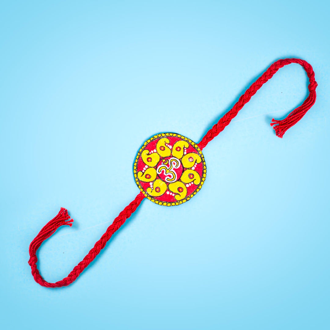 Hand Painted Seed Rakhi Red - Flat Lay Front View
