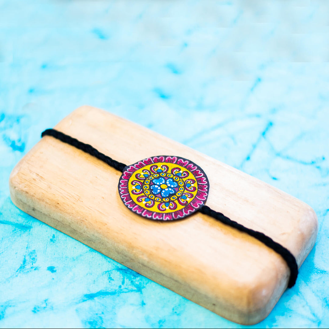 Hand Painted Seed Rakhi Black - Display on Wooden Block