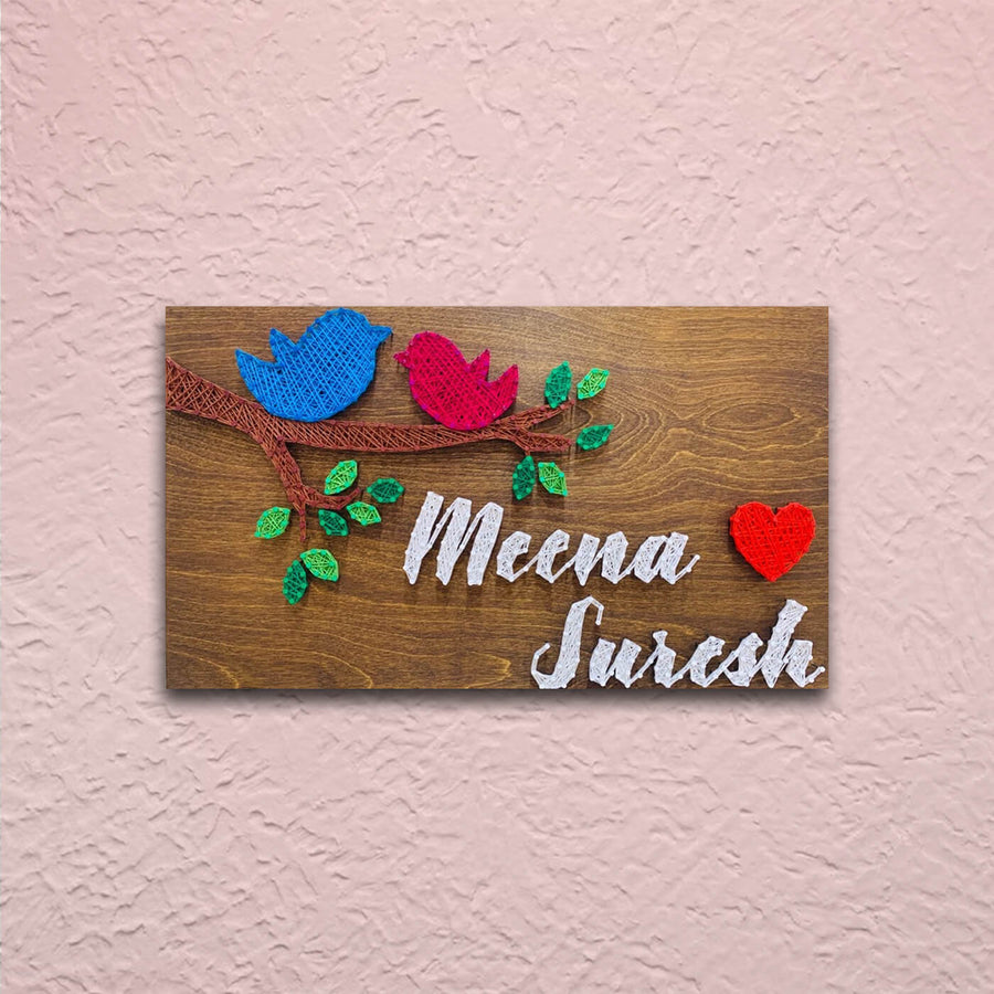 Rectangular String Art Name Plate With Sparrows - Mounted on Textured Wall Close-up