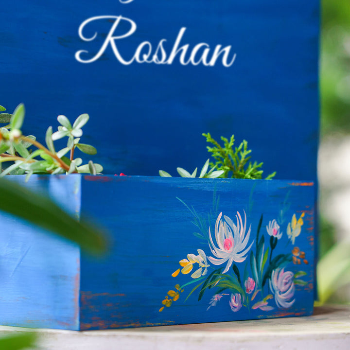 Handpainted Half Planter Name Plate White Flowers On Dark Blue Wood - Close-up of Hand-painted Side Detail