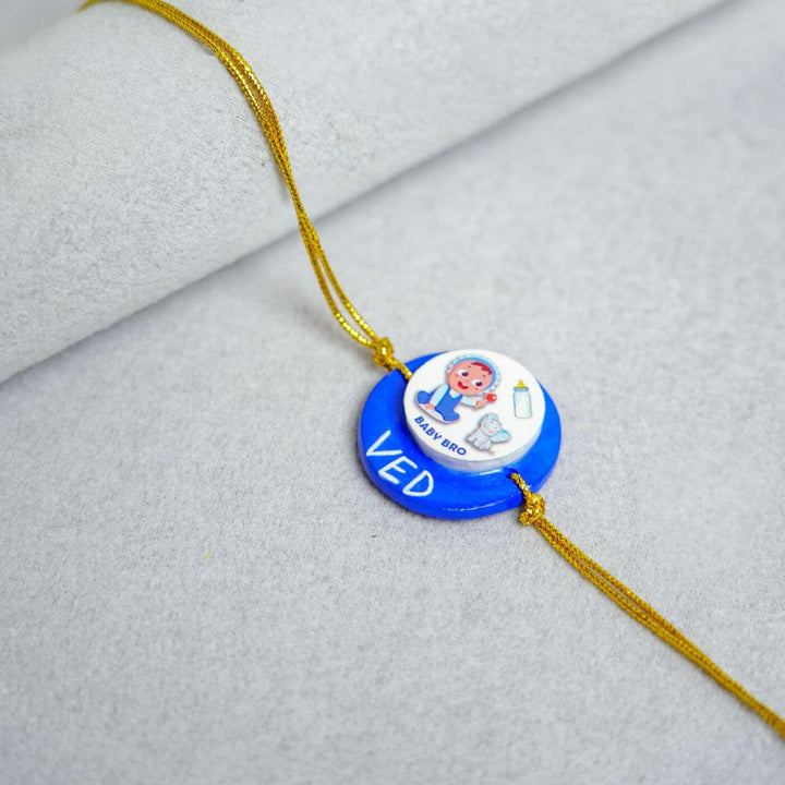 Handmade Personalized Rakhi Keychain With Roli Chawal 2 - Close-up of Rakhi design