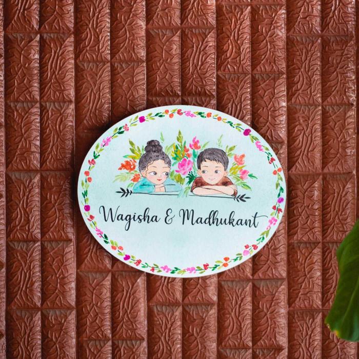 Oval Hand Painted Character Name Plate For Couples - Front View on Textured Background