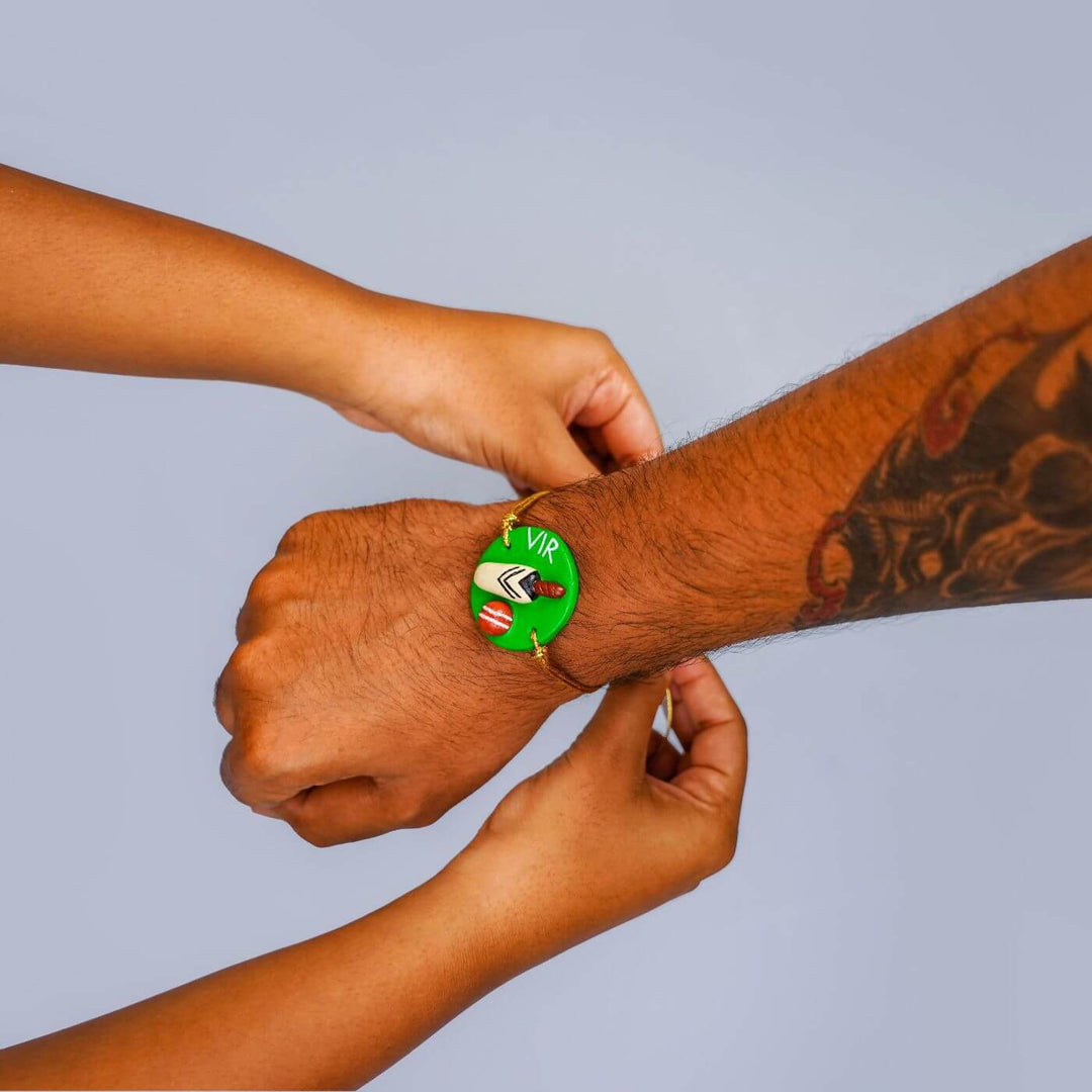 Handmade Personalized Rakhi Keychain With Roli Chawal 4 - On wrist wear demonstration