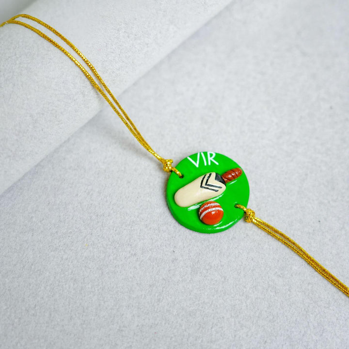 Handmade Personalized Rakhi Keychain With Roli Chawal 4 - Close-up of Rakhi pendant