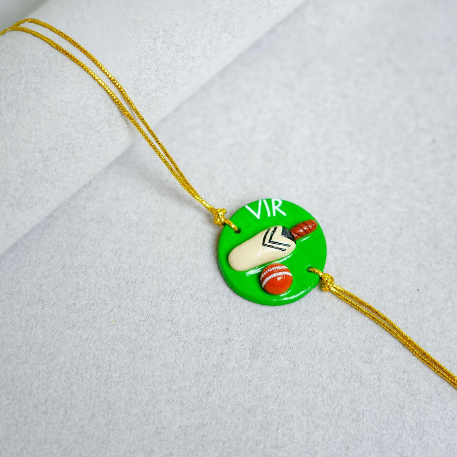 Handmade Personalized Rakhi Keychain With Roli Chawal 4 - Close-up of Rakhi pendant
