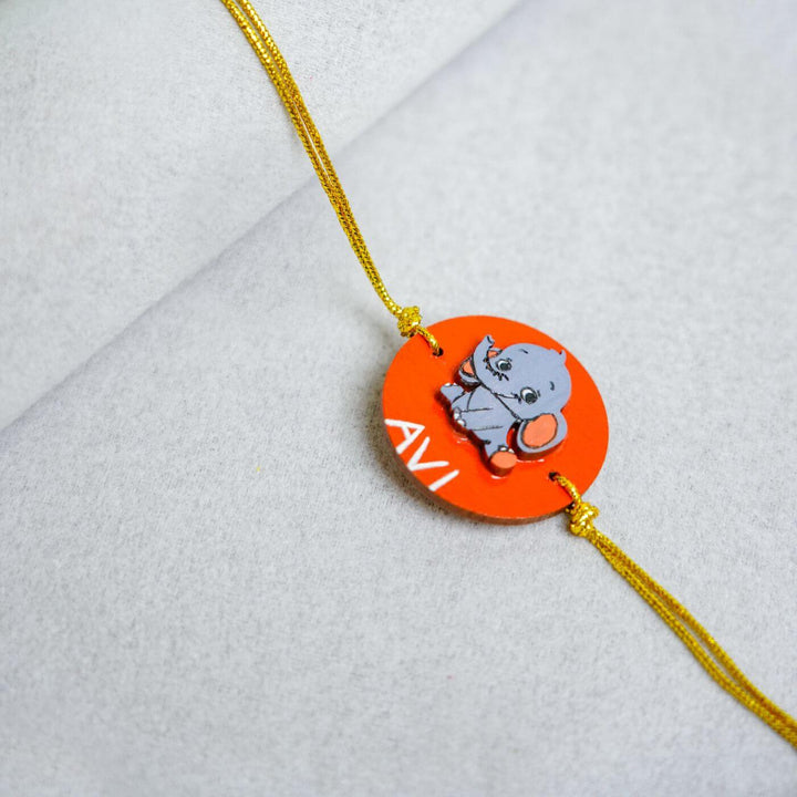 Handmade Personalized Rakhi Keychain With Roli Chawal 5 - Close-up of rakhi charm