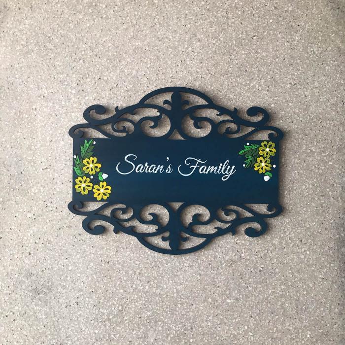 Family Name Plate With Hand Painted Madhubani Art - Front View on Floor Background