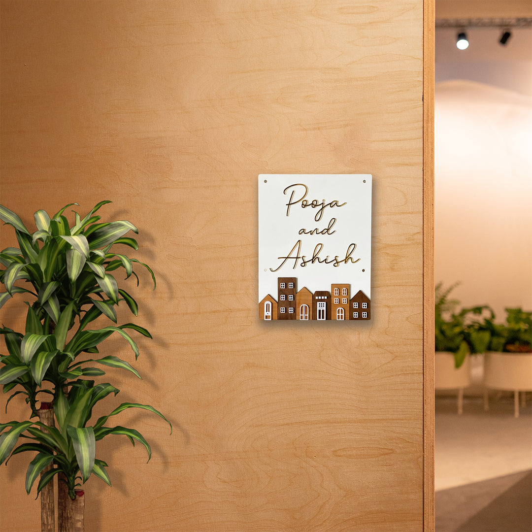 Personalised Acrylic Rectangular House Name Plate - Mounted on Wall with Plant Nearby