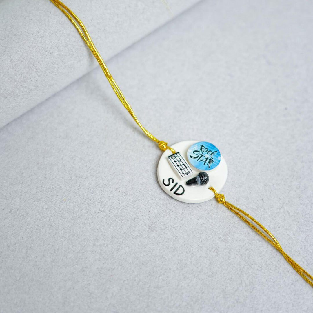 Handmade Personalized Rakhi Keychain With Roli Chawal 3 - Close-up of Rakhi details