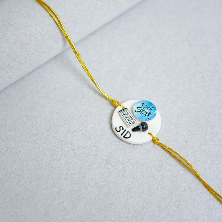 Handmade Personalized Rakhi Keychain With Roli Chawal 3 - Close-up of Rakhi details