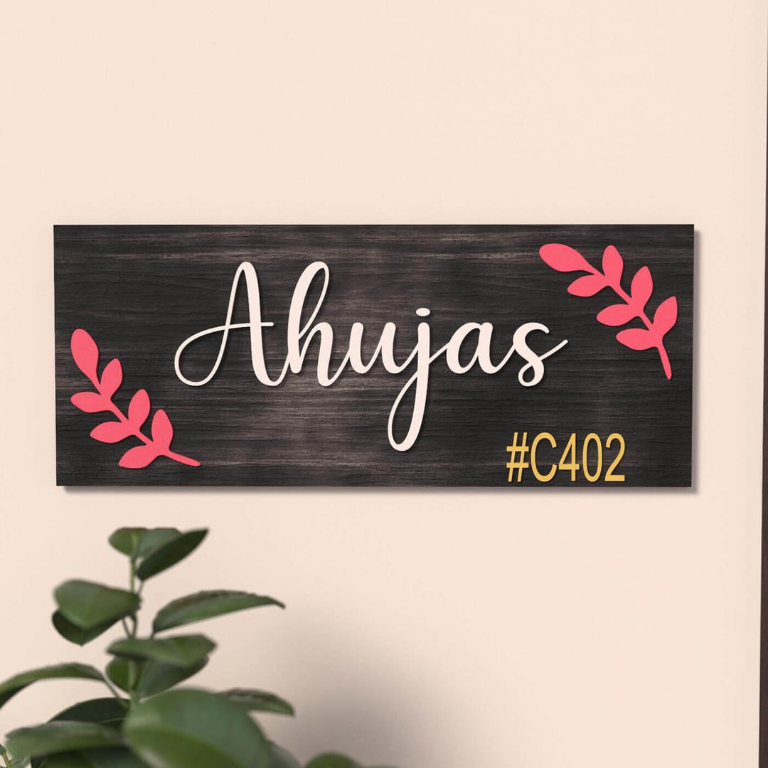 Rectangular Family Name Plate Black - Front View on Wall with Decor