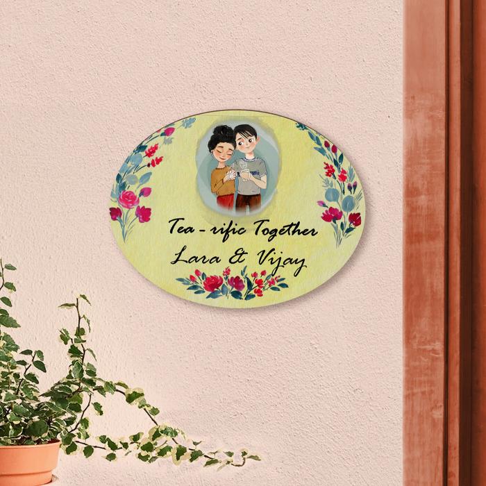 Oval Hand Painted Character Name Plate For Couples With Quirky Quote - Mounted on Wall with Plant Nearby
