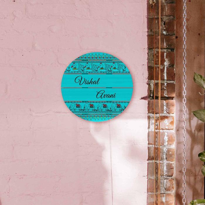 Teal Circle Name Plate With Madhubani Design - Mounted on Pink Wall Display