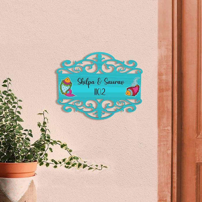 Teal Name Plate With Fish Design - Mounted on Exterior Wall Next to Door