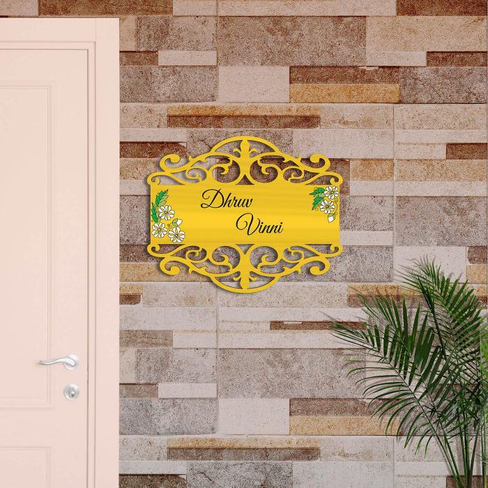 Yellow Rectangle Couple Name Plate With White Lotus - Mounted on Exterior Brick Wall